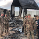 U.S. troops review damage to Ain Al-Asad air base from an Iranian missile strike earlier this month.